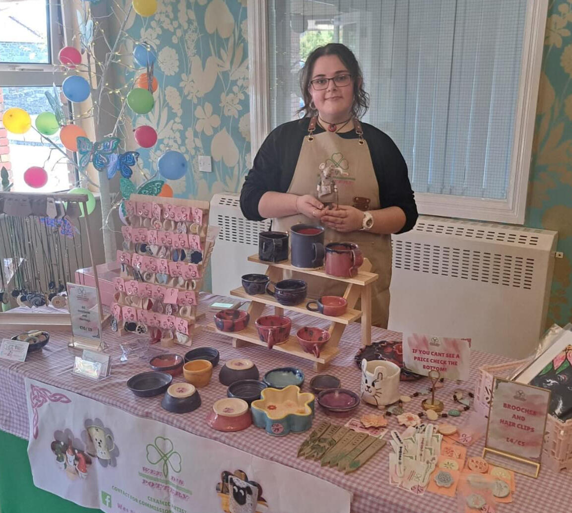 Untitled Dearbhla at a craft fair with a wide selection of pottery products