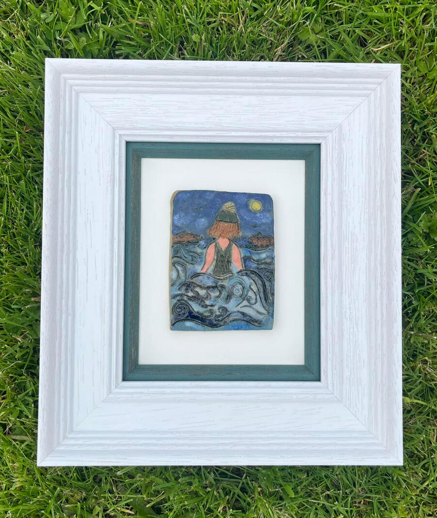 A hand-crafted framed pottery display