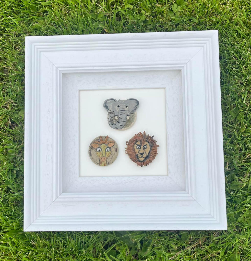 A hand-crafted framed pottery display